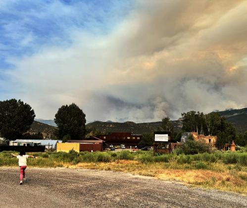 Editor's daughter, Ava Andrade, playing as smoke billows in the background Photo by Katey Fetch