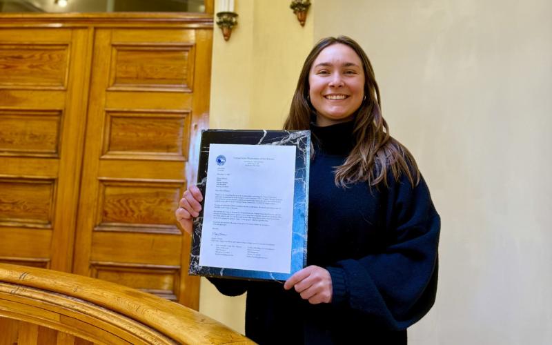 Town of SIlverton's Community Development Director Lucy Mulvihill shows off the letter from the Department of the Interior announcing Town of Silverton's CLG photo by DeAnne Gallegos