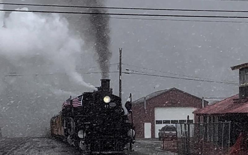 The last train of the summer season greeted with snow. Photo credit DeAnne Gallegos