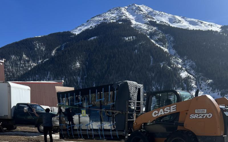 The delivery of the new grocery cases thankfully happened on a warm sunny winter day. Photo credit Darlene Watson