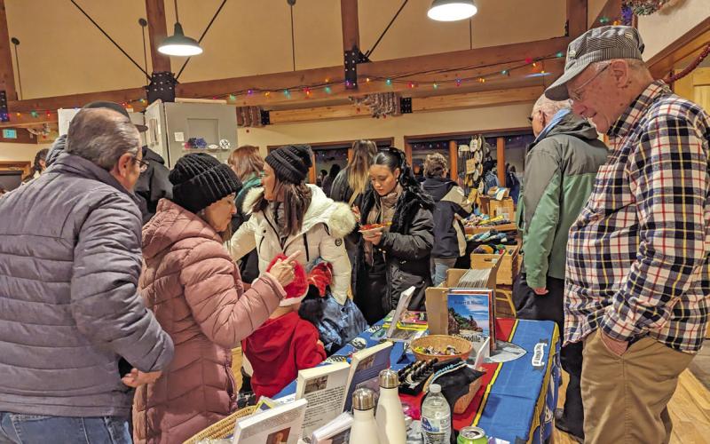 Train Store owner Bob Boeder and shoppers at the annual Mistletoe Market. Photo credit Silverton Creative District