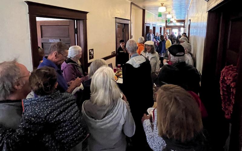 Photo By DeAnne Gallegos The community crowding in to thank Lois for her years of service