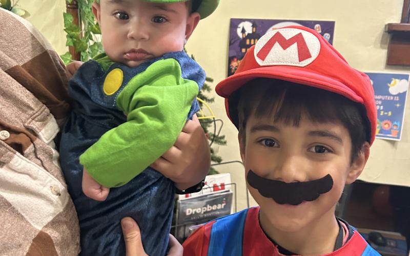 Photo by Misti Anderson Jude and Owen Largent having fun at the library Halloween party.