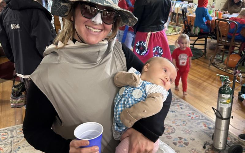 Sarah Wendlandt and Saoirse Fetchenhier-McChesney enjoying the library Halloween party. Photo by Misti Anderson