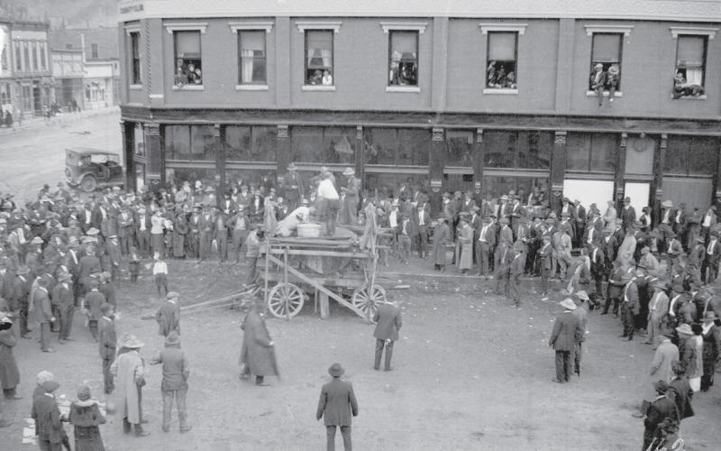 Early 1920s - Double hand drilling contest at the corner of 12th and Greene, with the Benson building in the background. Photo used courtesy of San Juan County Historical Society