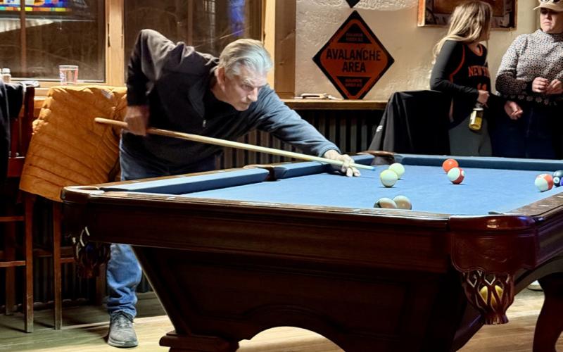 Longtime local Ken Boden jumps in on the pool game, taking his shot very seriously photo by DeAnne Gallegos
