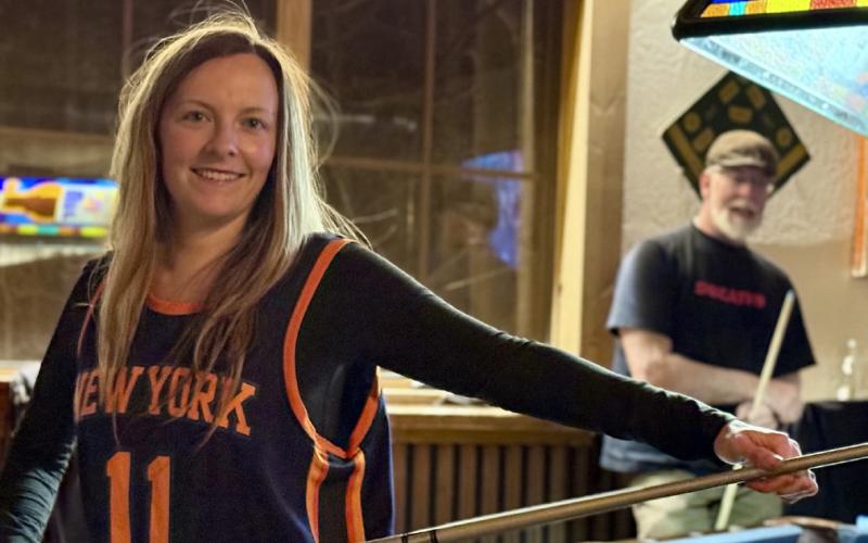 Amie Gardiner, aka “pool shark,” shows off her pool stick skills in the mezzanine at the Eureka Station during shoulder season photo by DeAnne Gallegos