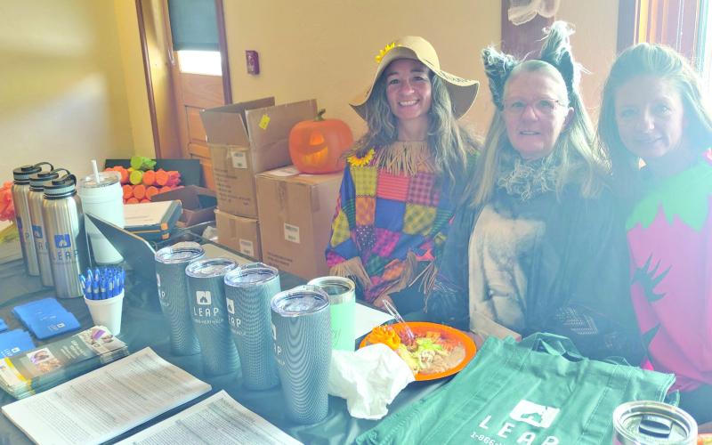 The Rhoades family at social services table. Photo credit Dayna Kranker