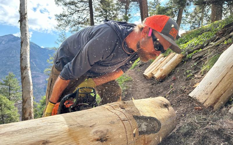 Michael Crockett proprietor of Anthrocene Contracting is removing timber and creating trail stairs out of it. Photo credit Anthrocene Contracting