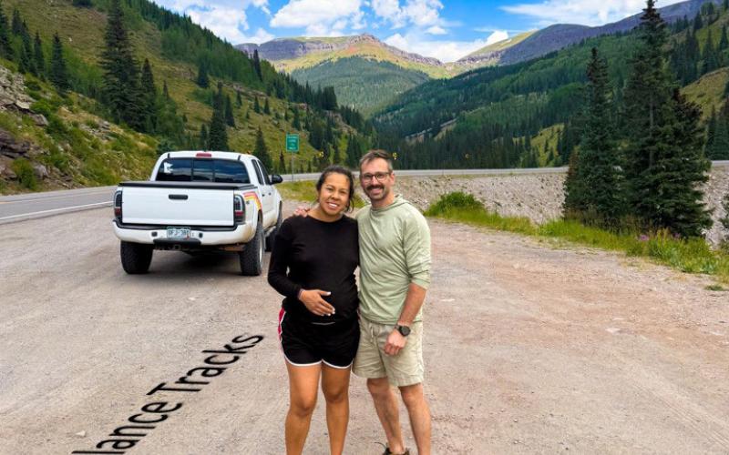 Davita Strong and Cole Maymark pose where baby 'Turbo' was born at mile marker 60. Photo by Davita Strong