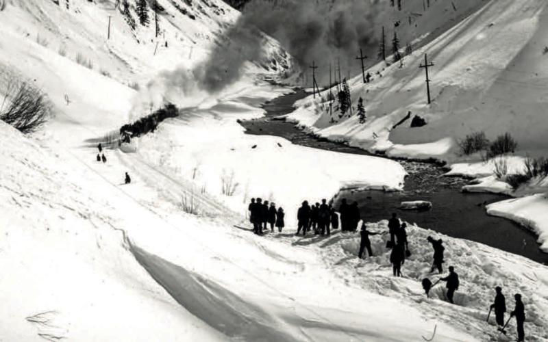 An undated post card of snow clearing on a slide along the Denver and Rio Grande Railroad south of Silverton. Menare hand-shoveling while passengers have walked to make a connection to a south-facing train beyond the slide. Photo courtesy of San Juan County Historical Society