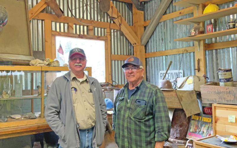 Bill Jones and Jake Gallegos Standing in front of the mining artifact display at the gift shop Photo credit Hillary Cable