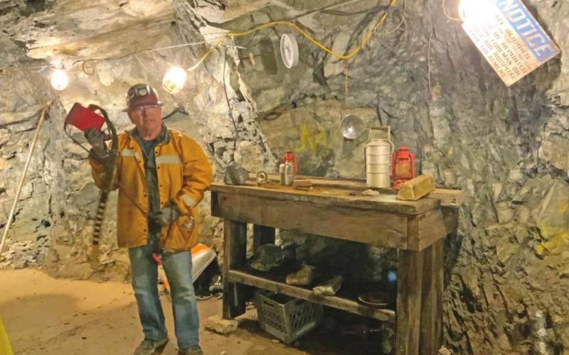 Jake Gallegos explaining how miners illuminated their work space Photo credit Hillary Cable