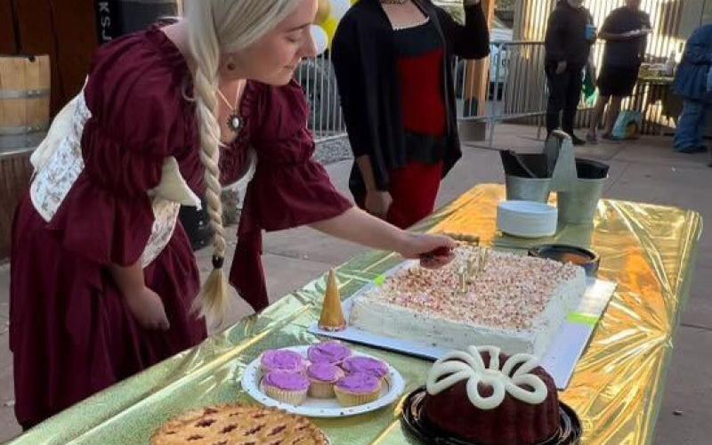 Melina Marks Lanis Town of Silverton Clerk and Mayor Dayna Kranker serve the town birthday cake. Photo Credit DeAnne Gallegos