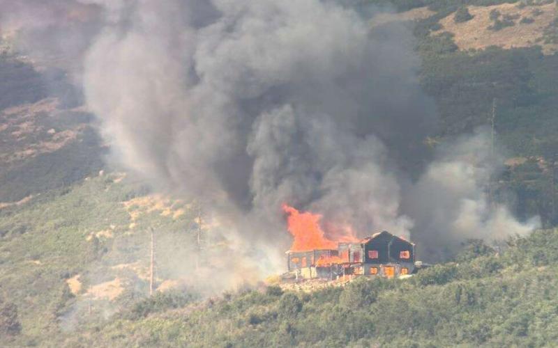 The Elkhorn Fire started at this luxury log home under construction on Saturday, July 26th. Photo credit Dave Dillon