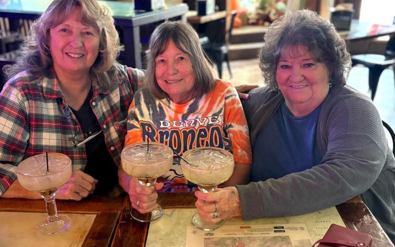 Longtime locals and multi-generational family Bingel sisters Charla Bingel Andreatta, Sue Bingel Sanders, and Patty Bingel enjoy the New Year, celebrating with the Alpine Tavern’s Gingerbread Margaritas photo by Charla Andreatta