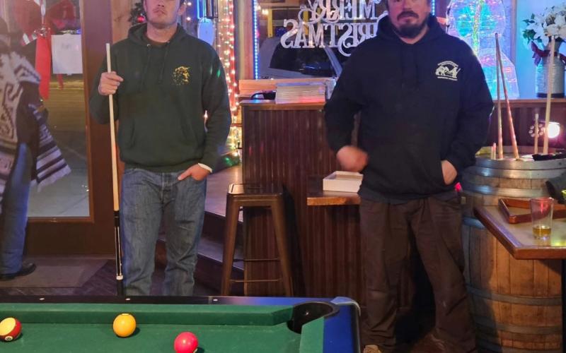 Tristan Mordecai and Rusty Melcher play a game of pool on New Year's, photo by Alpine Tavern