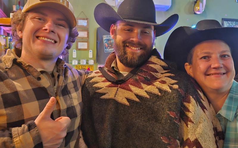 John, Trevor, and Kelli share a cheers for New Year's photo by Alpine Tavern