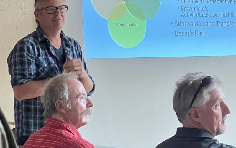 Anthony Edwards, San Juan County’s BPMD Liaison, gives an update at the community event (SJC Scott Fetchenhier in red shirt also attended the event). Photo credit DeAnne Gallegos