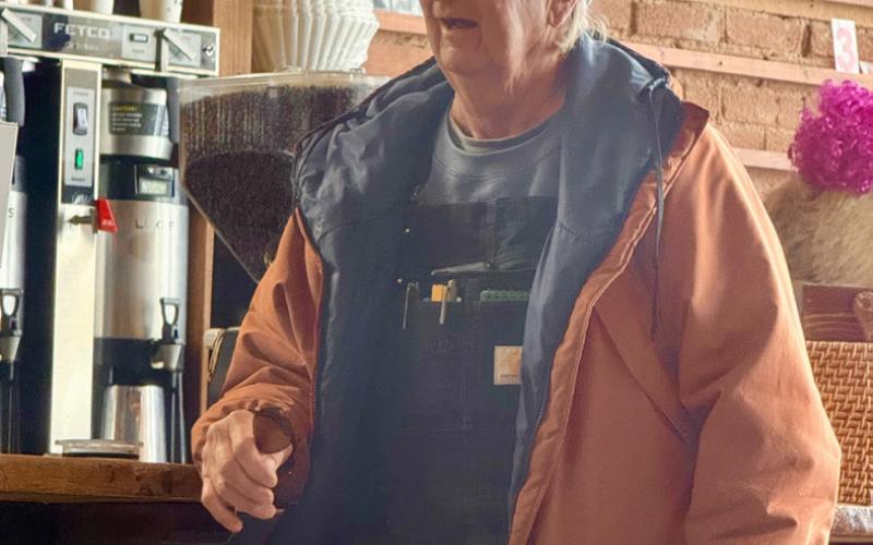 Longtime local Tommy Evans gets his morning brew at Coffee Bear and catches up with other locals in the coffee shop photo by DeAnne Gallegos