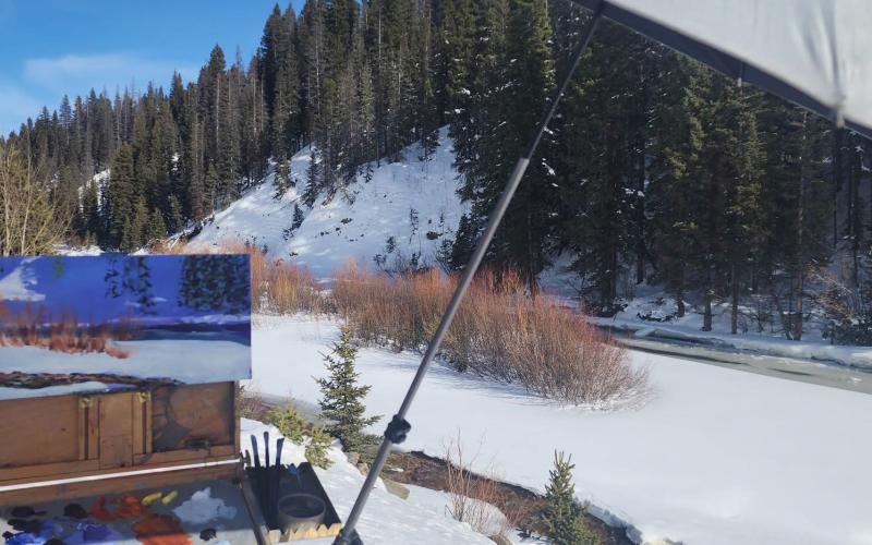 Longtime local artist Eileen Fjerstad sets up an plain air paint easel north of Silverton along the Animas River to capture the beauty of winter in the San Juans photo by Eileen Fjerstad