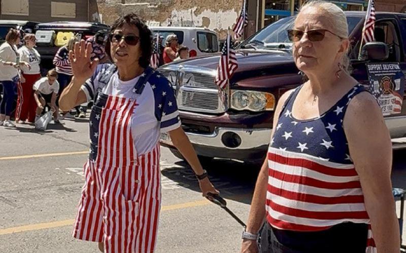Patty Dailey &amp; Becky Rhoades selling Fire Dept t-shirts in the 4th of July parade photo by DeAnne Gallegos