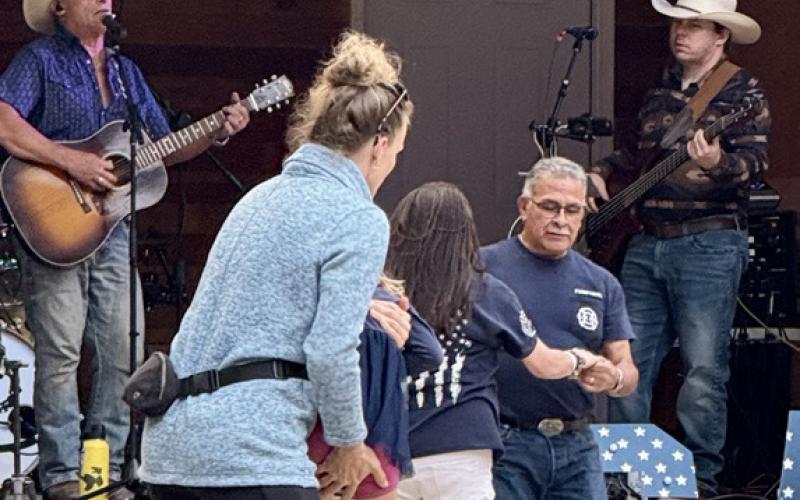 (LEFT) Hugh Phillips took the Geryak stage the evening of the 4th of July in Anesi Park. Gilbert Archuleta enjoyed a country dance with his daughter