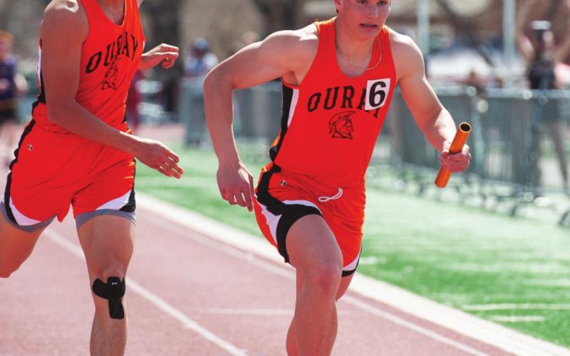 Paton grabbing the baton in the 4x400 relay. The team took first place in the this category. Photo Credit David Emory he team took first place