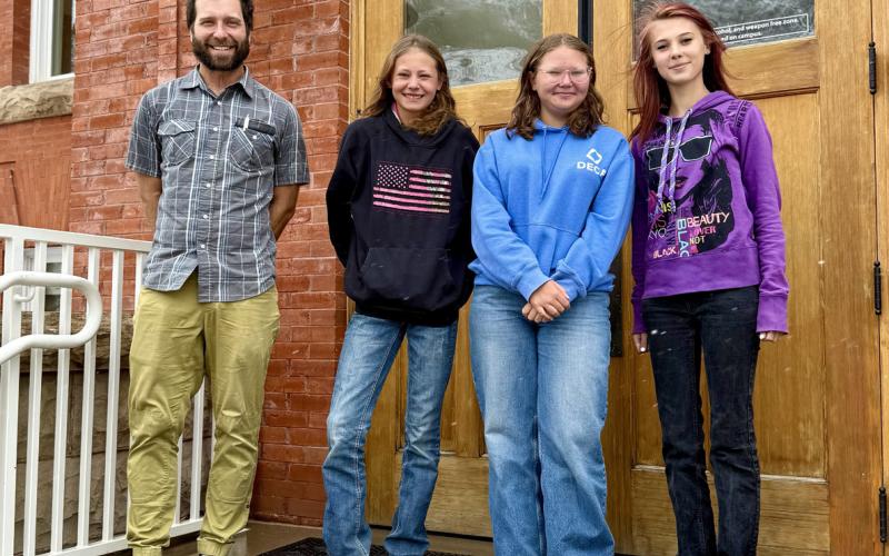 L to R Jordan Bierma, Alyana Hamm, Brynn Hamm and Patience Rhoades in front of the school on Monday Photo by DeAnne Gallegos