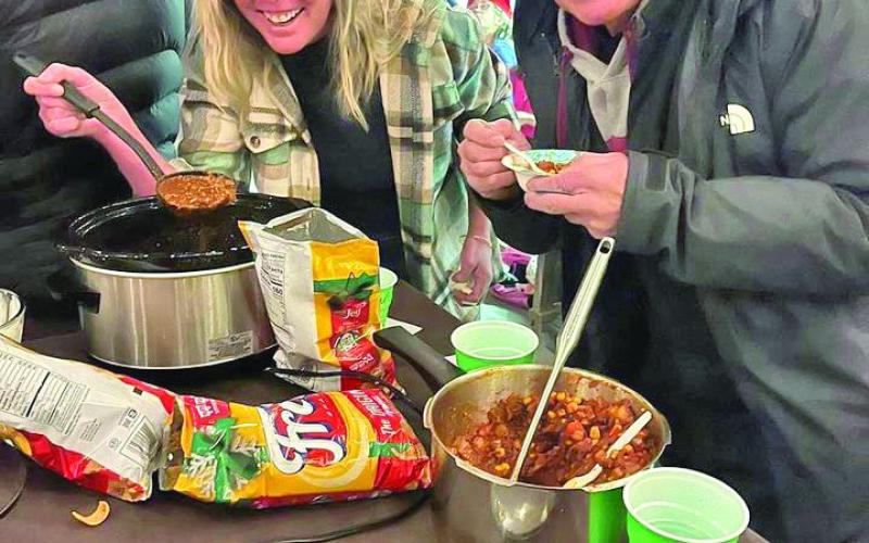Taste testing at the Chili Cook Off. Photo by Wendy Polly