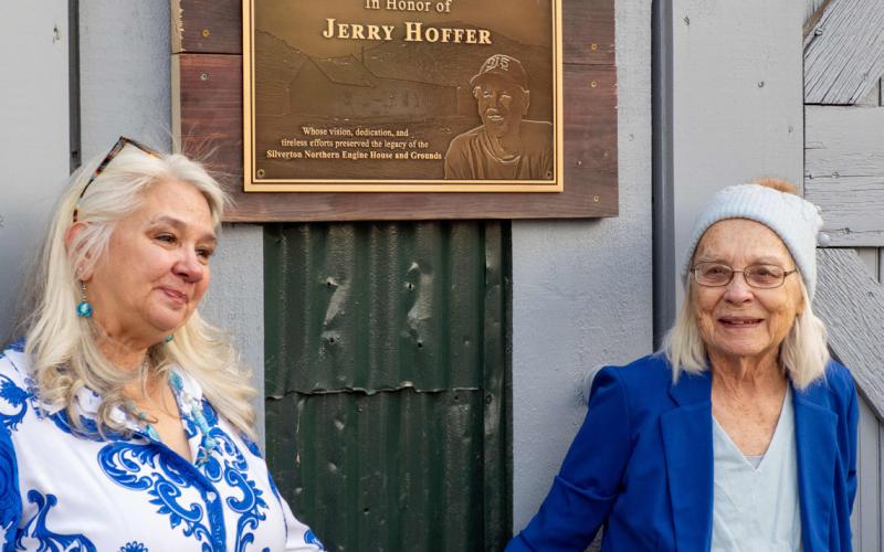 Jerry Hoffer’s daughter Molly Barela and his wife Nancy Hoffer in front of the plaque honoring him Photo by Ray Dileo