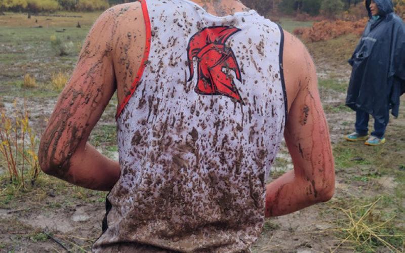 Jonah Kranker showed off the mud kicked up onto his jersey at last weekend’s cross-country race. Silverton kids run on the Ouray team. Photo by Dayna Kranker