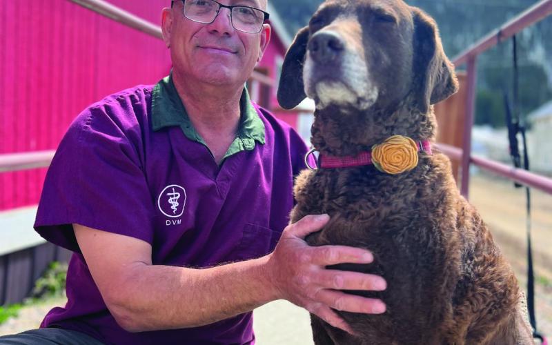 Dr Joe Alaimo with Diesel Dog at Senior Center. Photo credit DeAnne Gallegos