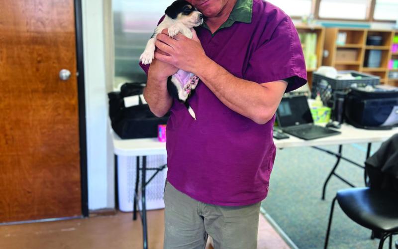 Dr Joe and a brand new patient. Photo credit DeAnne Gallegos
