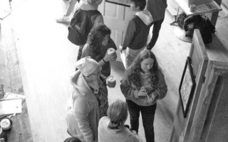 (left) Silverton Middle School welcomed community members to the Coffee Bear for the exhibit. They shared the story of their piece, a watercolor technique they learned, and why it is important to share this with the community.