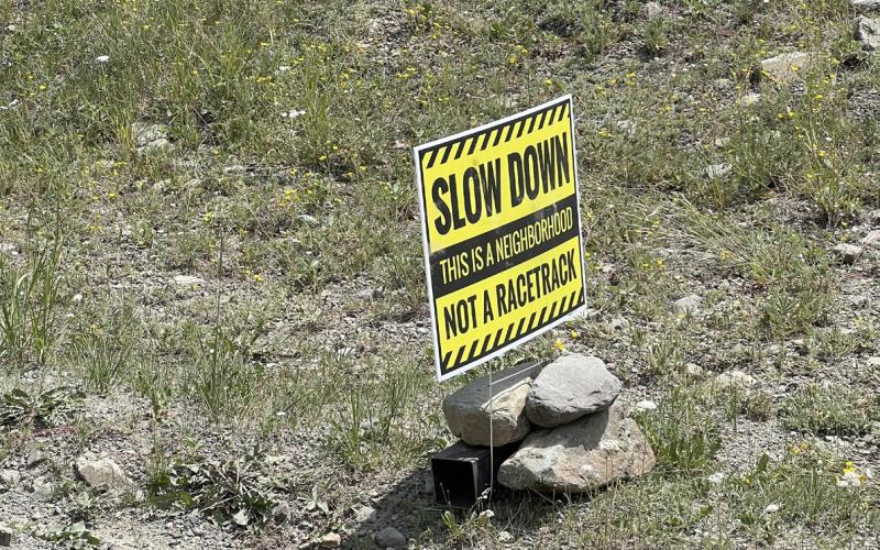Signs placed by county residents off of County Road 2. Photo credit DeAnne Gallegos