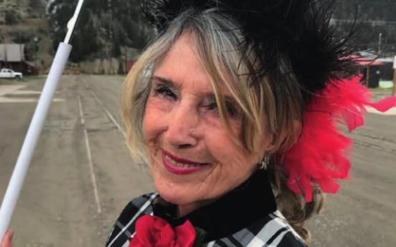 Miss Kitty: “Our population goes up. I don’t know if you know anything about Miss Kitty, but there’s a mighty fine gentleman who comes up on that train from Durango who I like to meet. And, of course, this is also when Miss Kitty gets to welcome all the fancy ladies of Greene Street to Blair Street.”