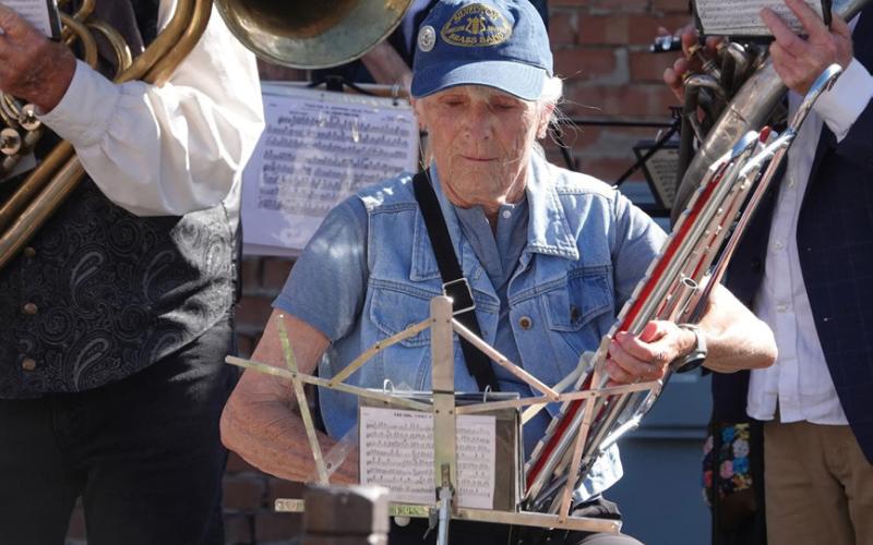 Paulette Schmalz playing in the Silverton Brass Band in Harmony Park photo by Kevin Lemmons