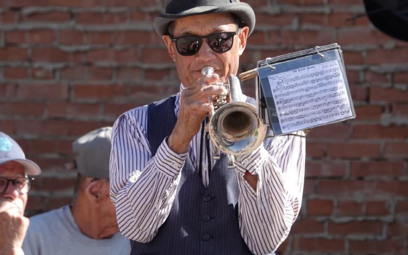 Loren Lew playing trumpet in the Silverton Brass Band concert in Harmony Park on Friday afternoon photo by Kevin Lemmons