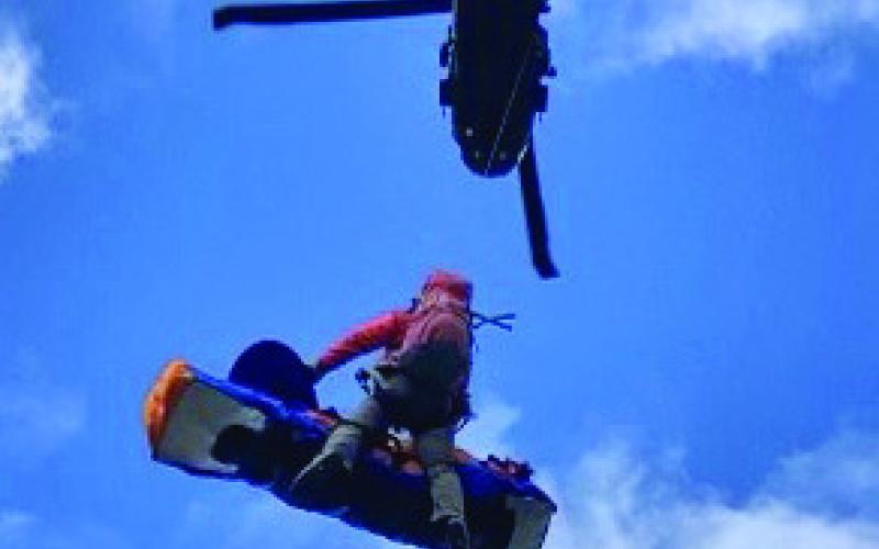 The patient being lifted by the Blackhawk helicopter Photo credit Silverton Medical Rescue