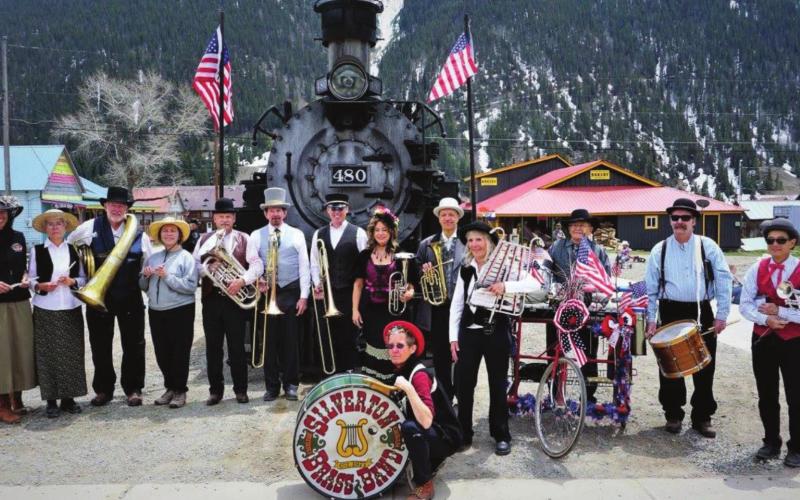 The Silverton Brass Band poses in front of the train. The Band celebrated its 45th years of music this year. Photo Credit Judy Zimmerman