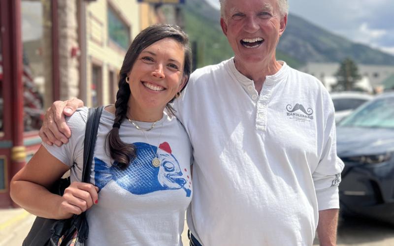 Photo credit DeAnne Gallegos Silverton Mayor, Dayna Kranker and Ken Boden, owner of Handlebars Restaurant, discuss bear-proof trashcans around town and share a laugh together.