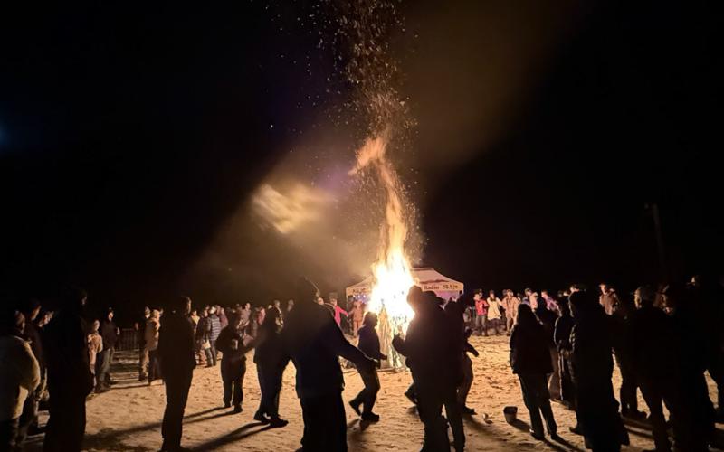 Locals cheerfully danced around the bonfire under the full moon photo by DeAnne Gallegos