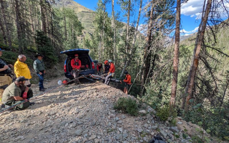 SMR repeling down the revine to access the patients involved in the OHV rollover photo by SMR