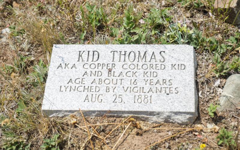 A gravestone for Kid Thomas details his murder by vigilantes. Photo by Ziyi Xu, Rocky Mountain PBS