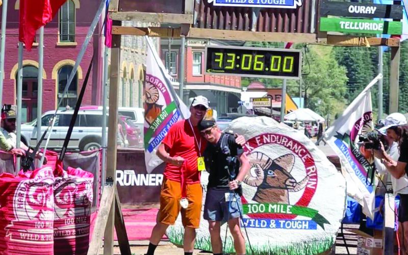12th place male finisher and Silverton local Avery Collins with Race Director Dale Garland. Photo Credit Deanne Gaellegos