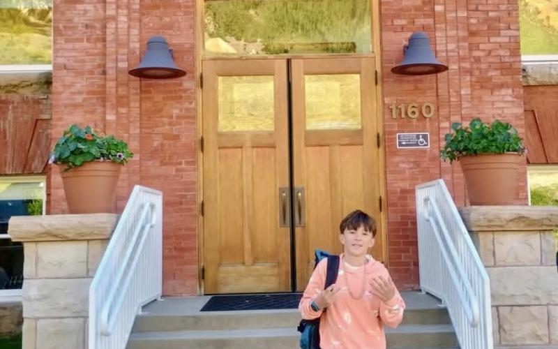 Bradford Brosh stands out front of the school to start 7th grade on Monday. His mom and dad, Megan and Chris Brosh, were happy to share the moment with him. Photo by Megan Brosh