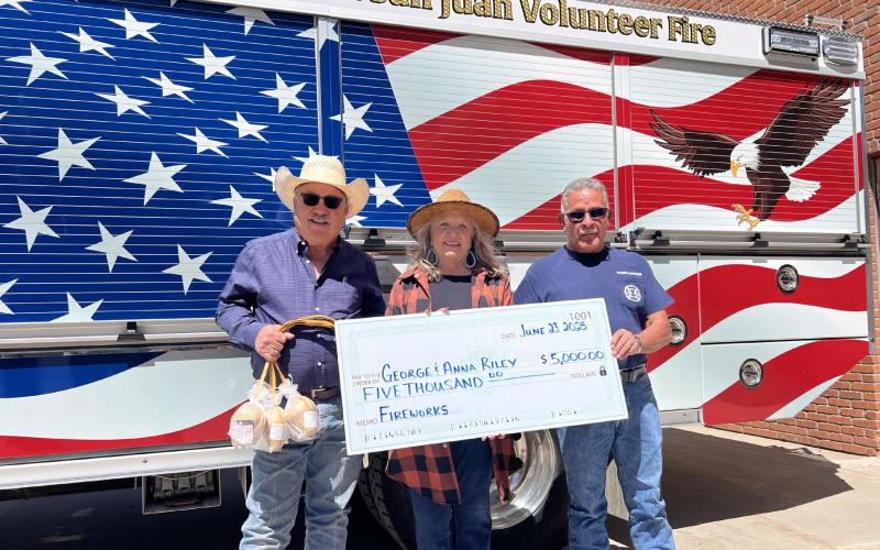 George and Anna Riley (left) donated $5,000 to the Silverton San Juan Volunteer Fire Department towards the fireworks show. Fire Chief Gilbert Archuleta (right side) accepted the check on behalf of the volunteer fire members. Photo credit DeAnne Gallegos