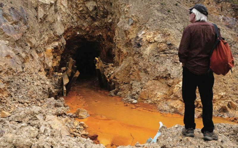 San Juan County Commissioner Pete McKay examines the Gold King 7 portal above Gladstone on Monday Aug 10 2015 photo by Farmington Times