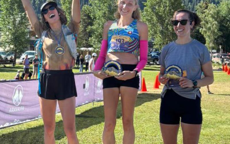 The top three female competitors on the podium. Photo credit Arvapai Running